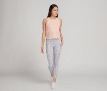 Load image into Gallery viewer, woman wearing high waisted grey and cantaloupe cheetah print leggings
