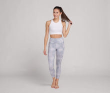 Load image into Gallery viewer, woman in grey printed high waisted leggings and white crop top
