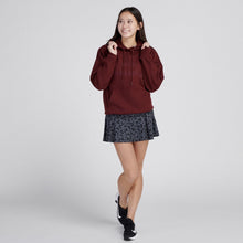Load image into Gallery viewer, Woman wearing maroon sweatshirt and printed grey tennis skirt
