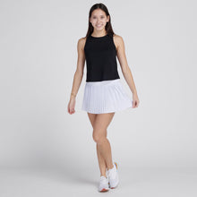 Load image into Gallery viewer, woman in grey pleated tennis skirt and black tank top
